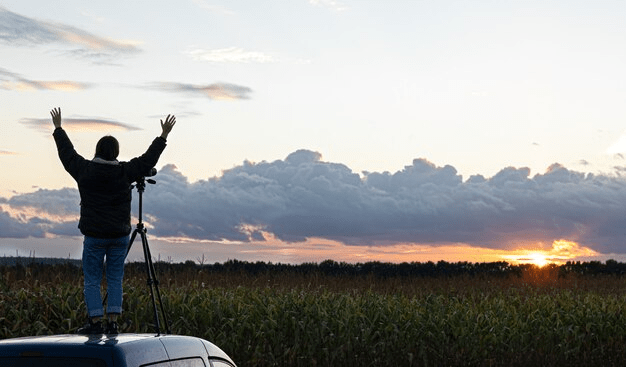 A calming sunrise over a serene field, symbolizing hope and recovery.