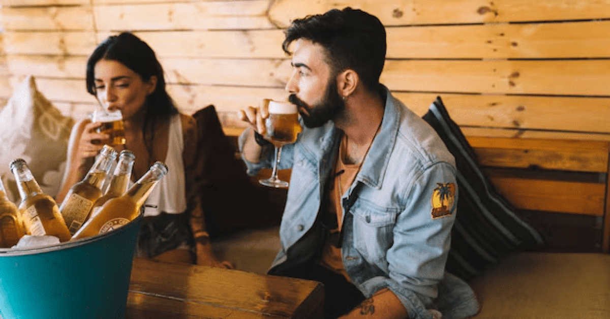 A person and person drinking beer