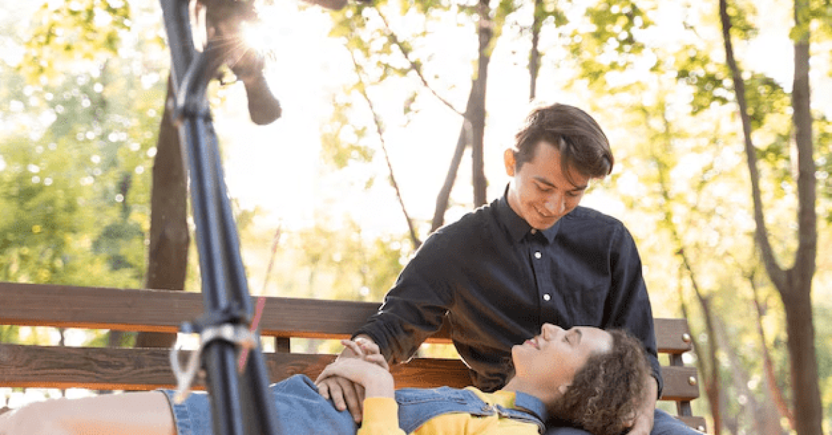 A happy couple discussing dating in recovery in a peaceful park setting, embracing the journey of sober dating with confidence.