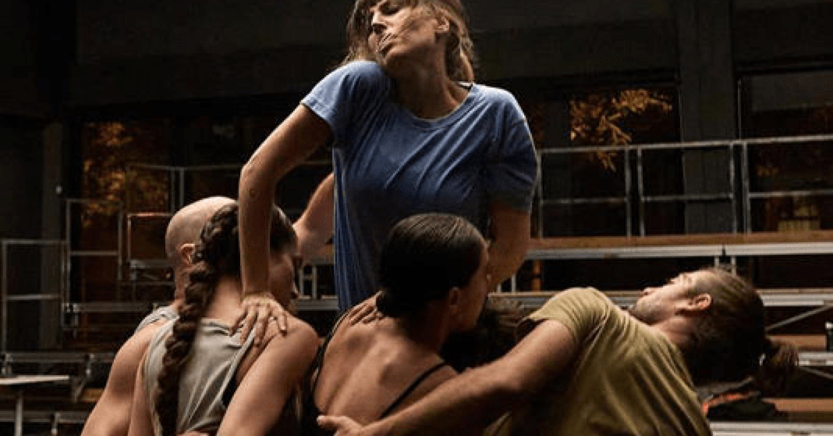 A group of people hugging each other in Dismantling an Elephant film