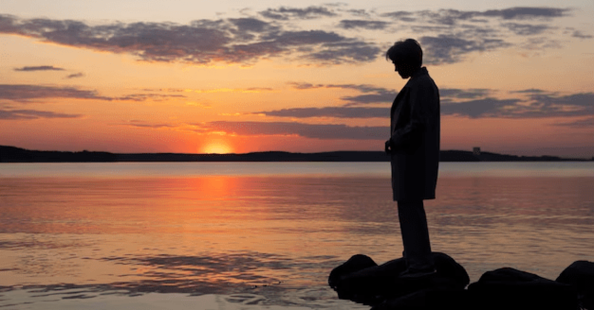 Person reflecting on their journey, finding purpose in sobriety with a peaceful mindset and personal growth in recovery.