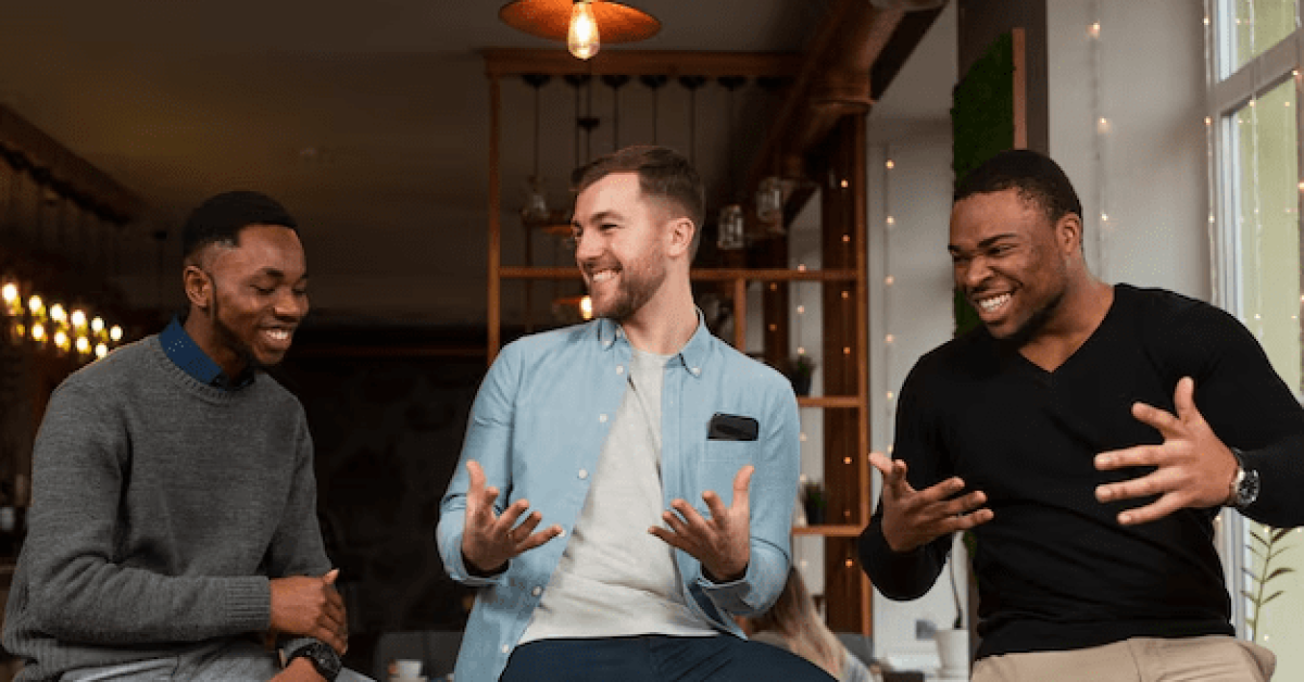 Men in addiction recovery support group discussing challenges and supporting each other in a welcoming environment.