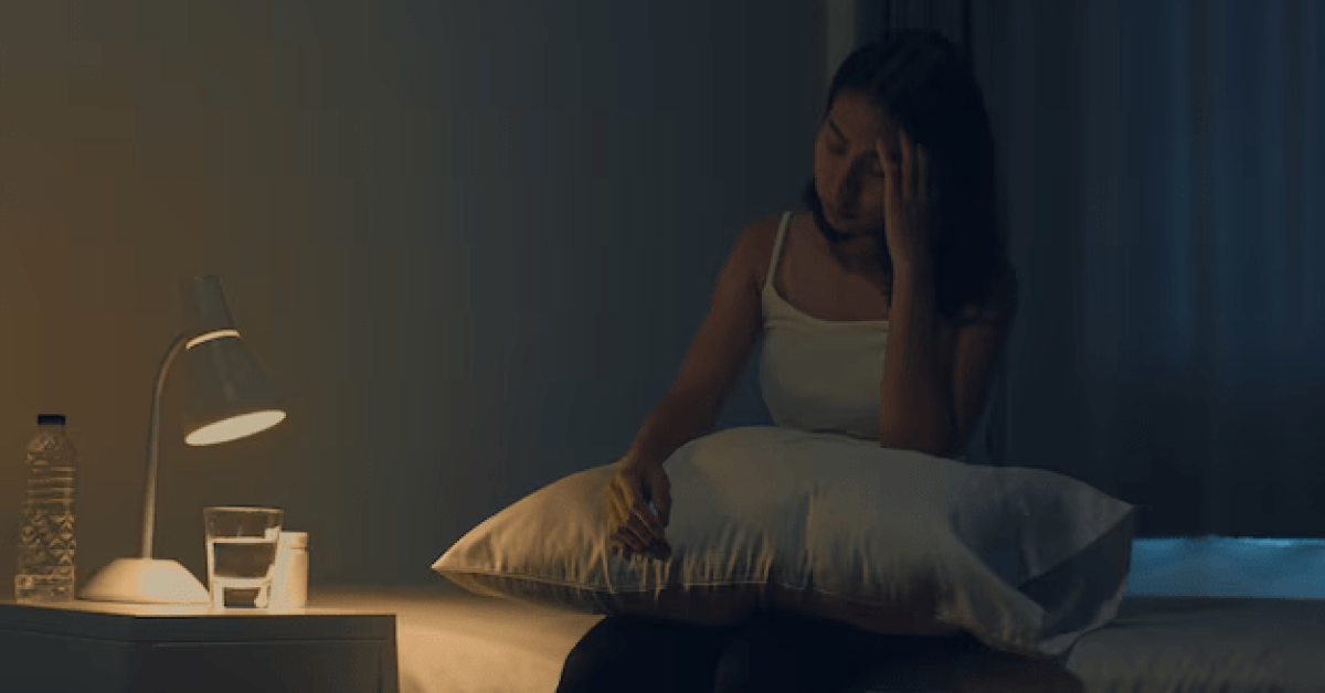 Person practicing sleepmaxxing by optimizing their sleep environment for deep recovery