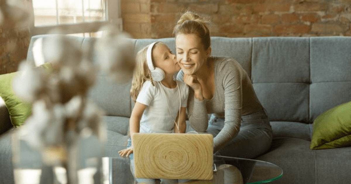 A parent in recovery bonding with their child at home, demonstrating sober parenting tips and parenting in sobriety through meaningful conversation.