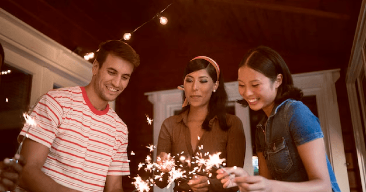 A group of people holding sparkler