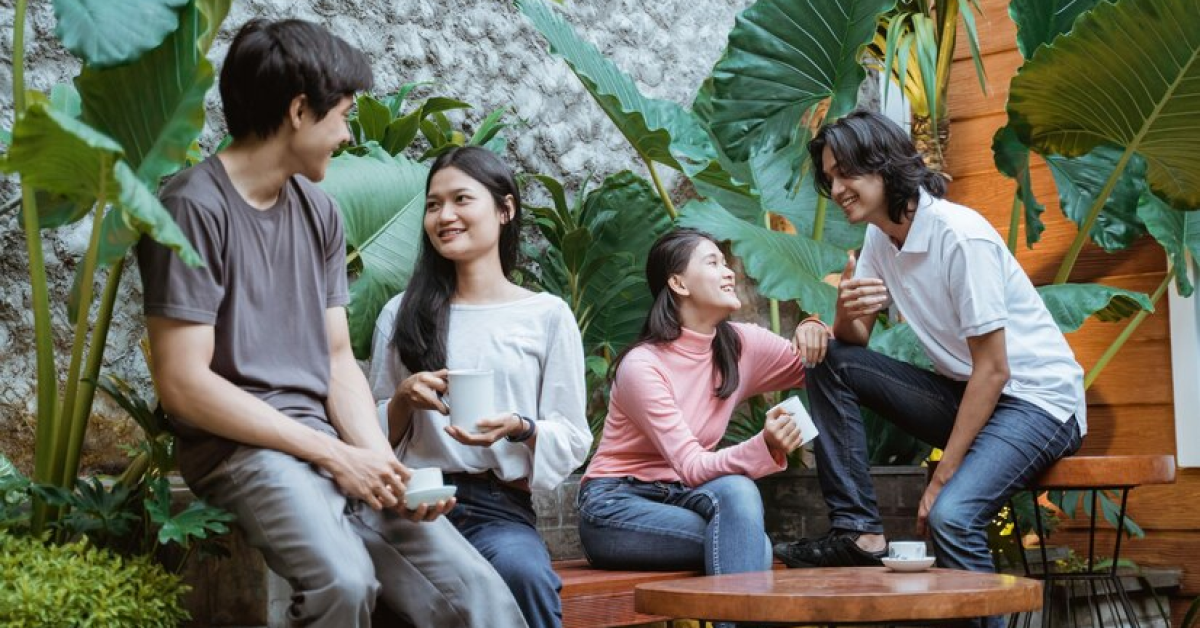 A group of people sitting on a bench