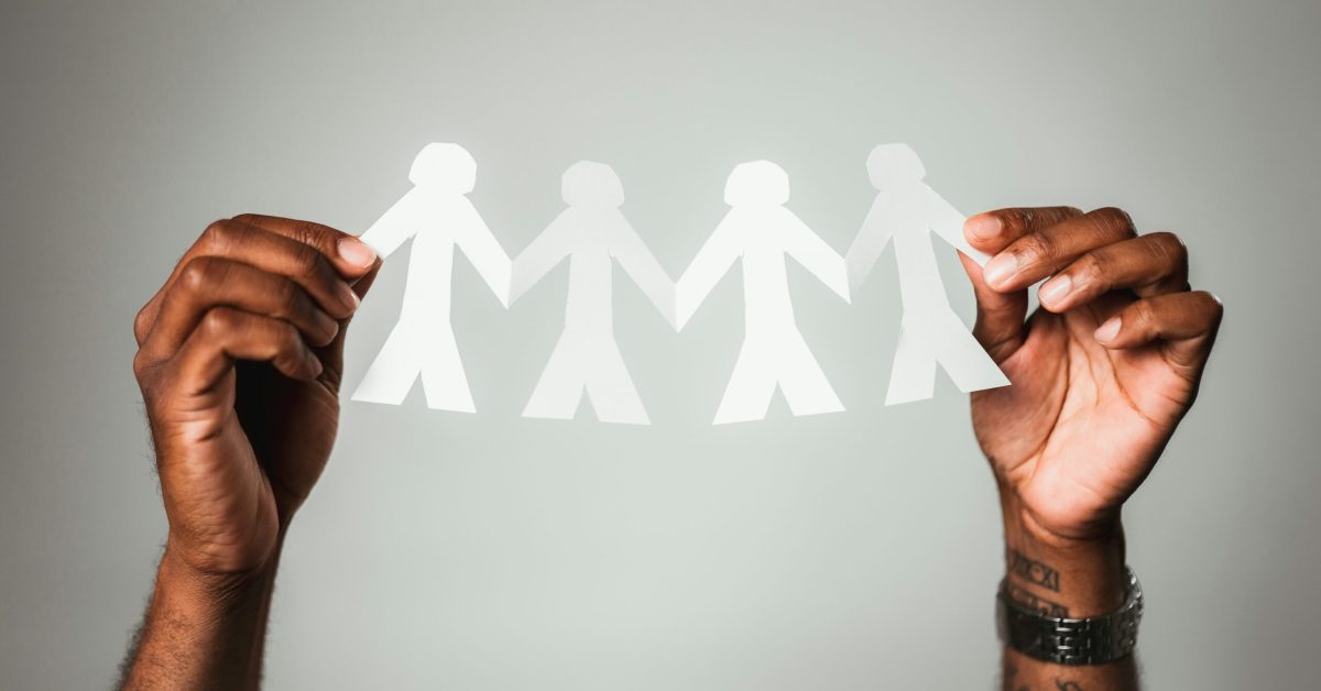 Diverse group of friends and family members forming a strong support system during recovery journey